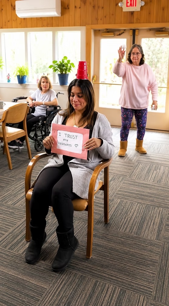 Residents and staff enjoying a recreational activity at Ethan Place